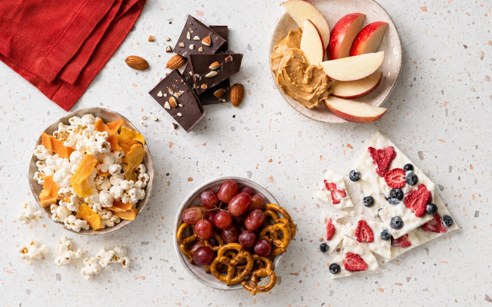 Sweet and salty snack ideas on a bright countertop